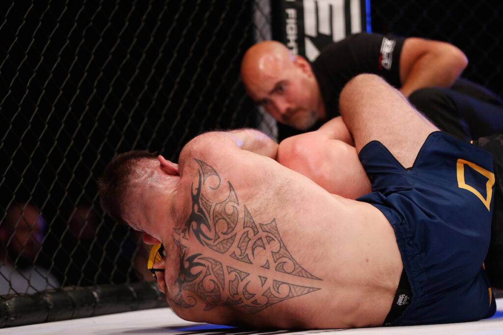 Andy Clamp secures a rear naked choke
