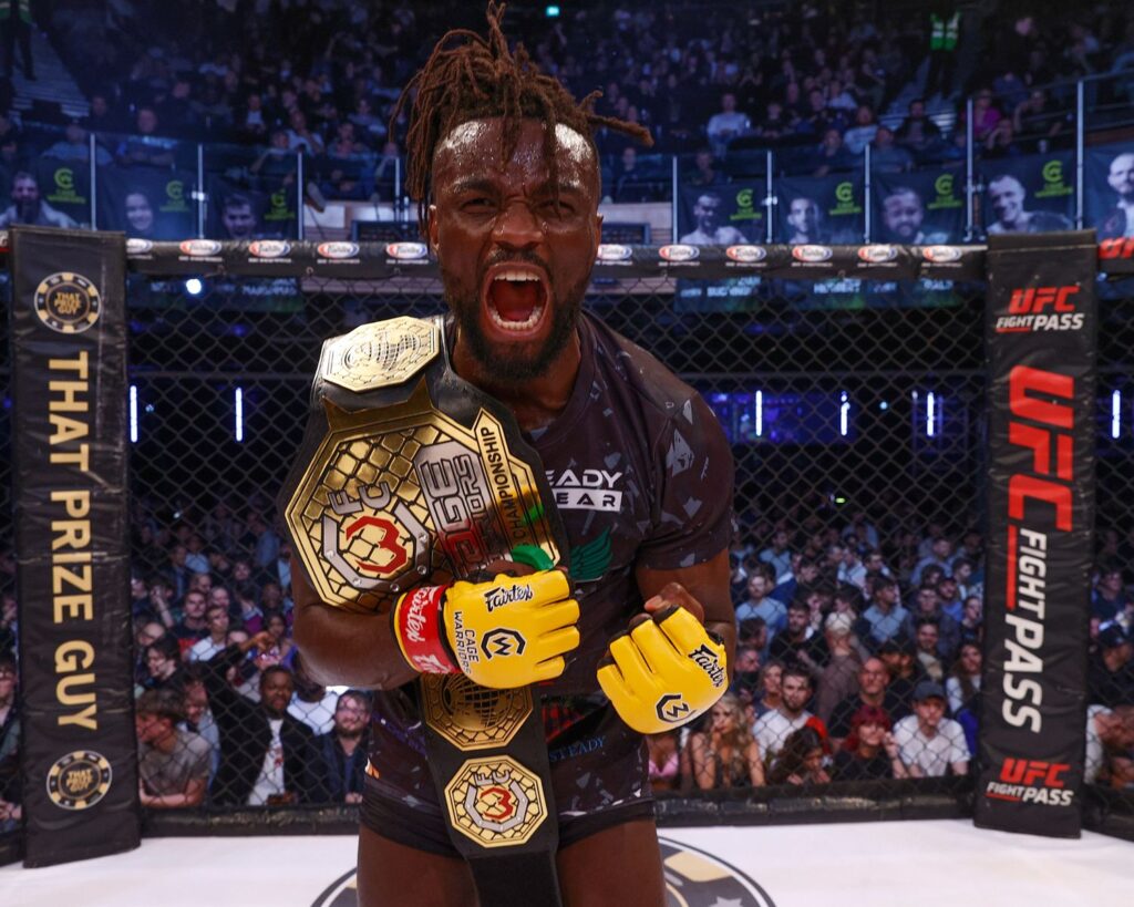 Solomon Simons celebrates his win in the cage