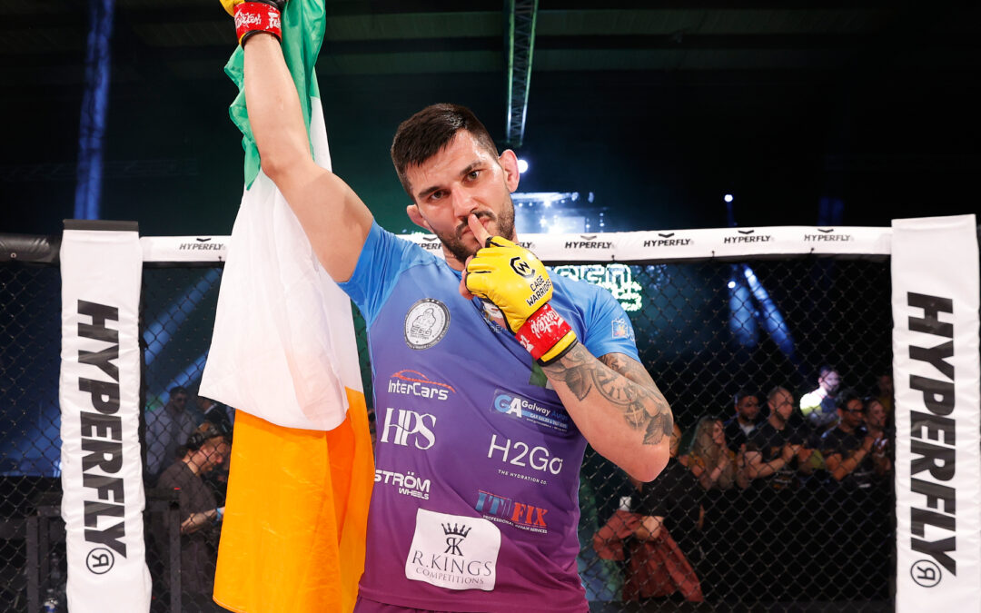 Andreeas Binder Celebrates in the Cage at CW Unplugged